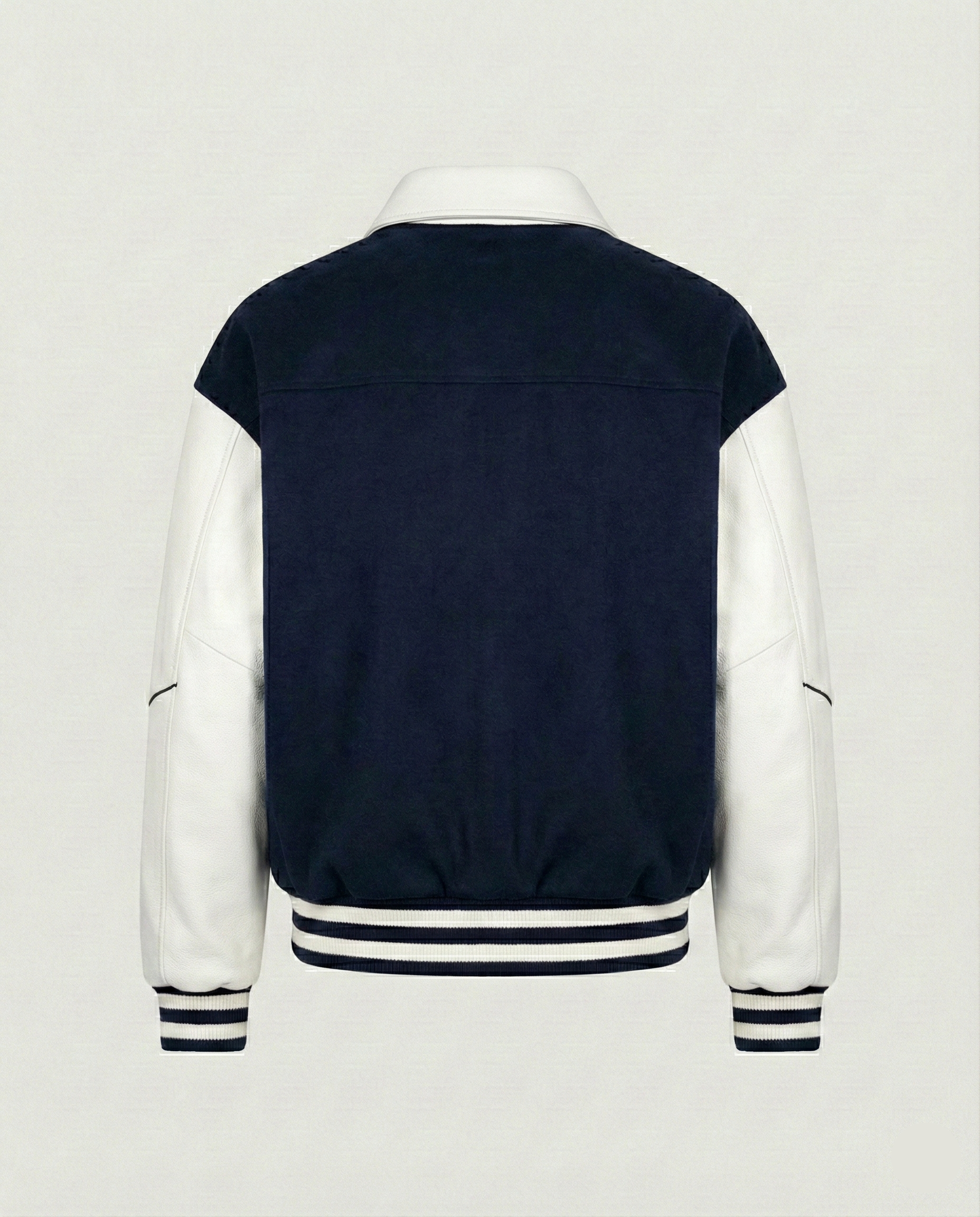 Navy and white varsity jacket on a light gray background