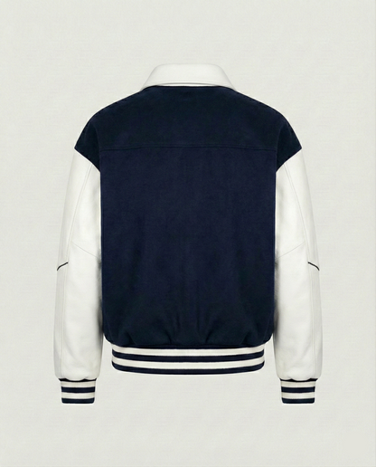 Navy and white varsity jacket on a light gray background