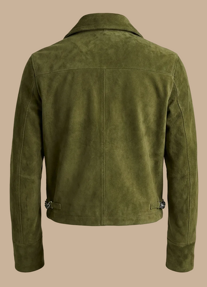 Green suede jacket on a beige background