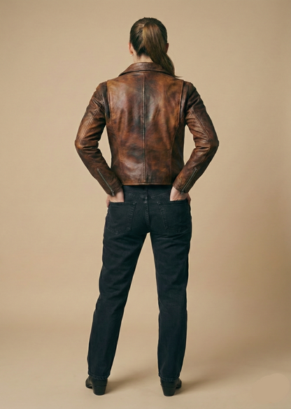 Women's distressed brown sheepskin leather biker jacket with silver hardware and animal print lining by Kingsmen Couture.