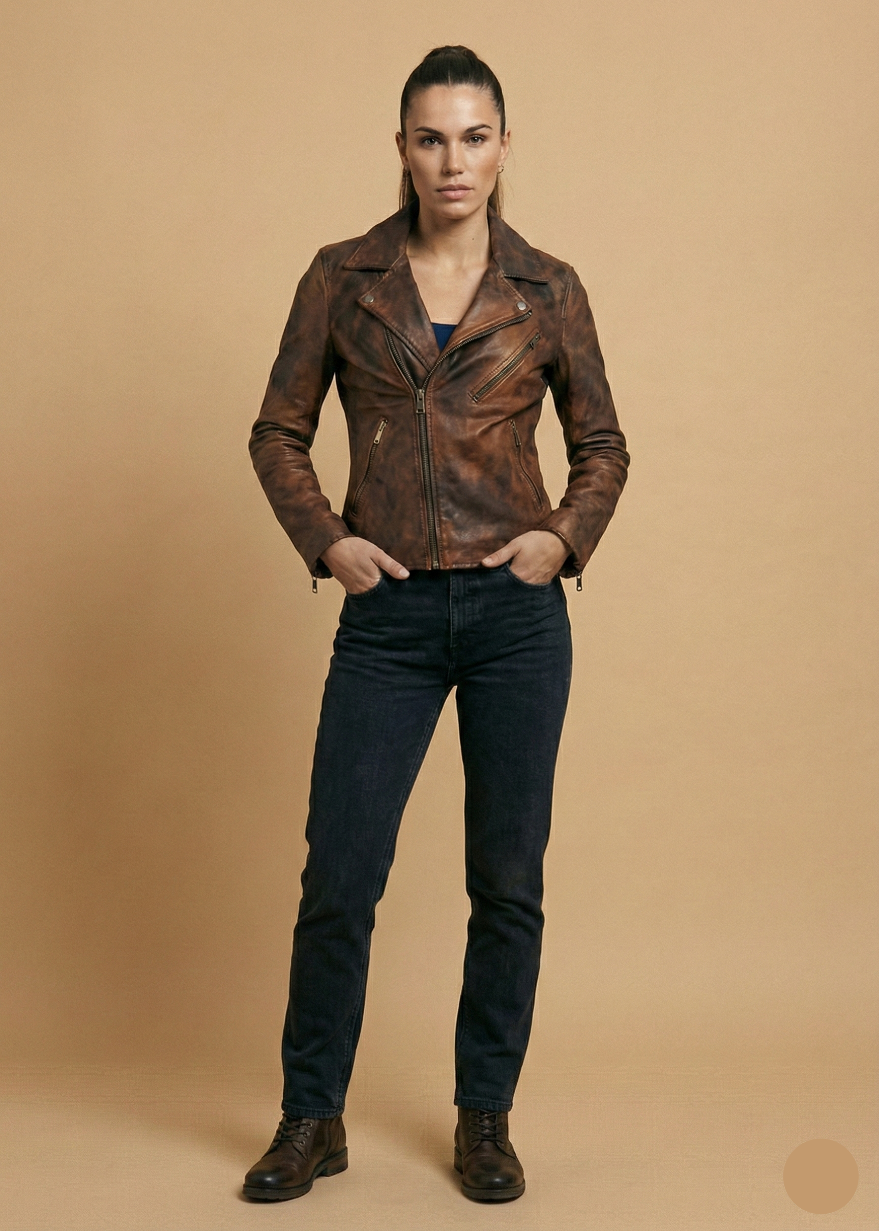 Women's distressed brown sheepskin leather biker jacket with silver hardware and animal print lining by Kingsmen Couture.