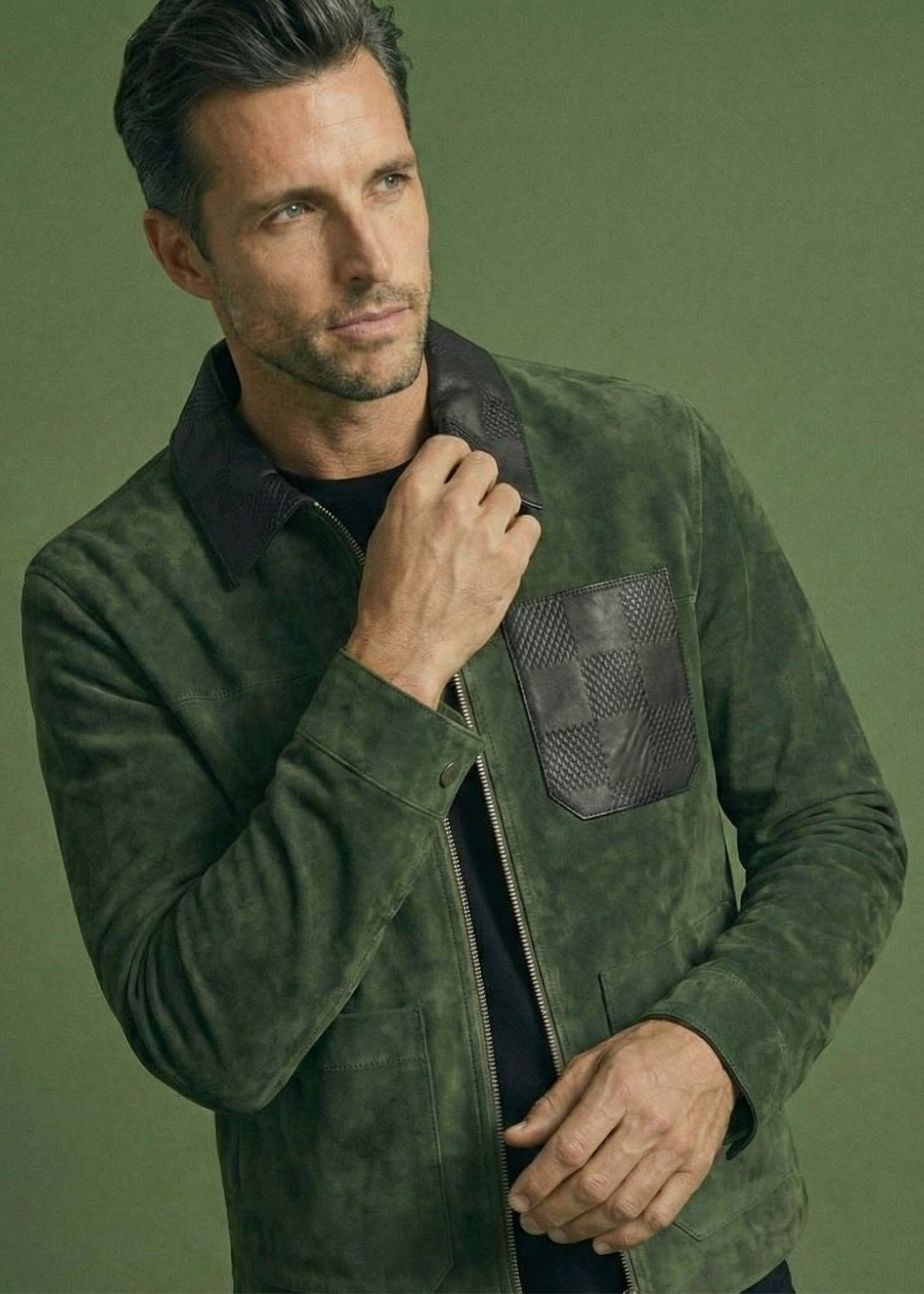 Men's green suede field jacket featuring a black checkered leather collar and chest pocket by Kingsmen Couture.