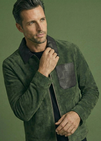 Men's green suede field jacket featuring a black checkered leather collar and chest pocket by Kingsmen Couture.