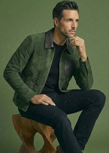 Men's green suede field jacket featuring a black checkered leather collar and chest pocket by Kingsmen Couture.