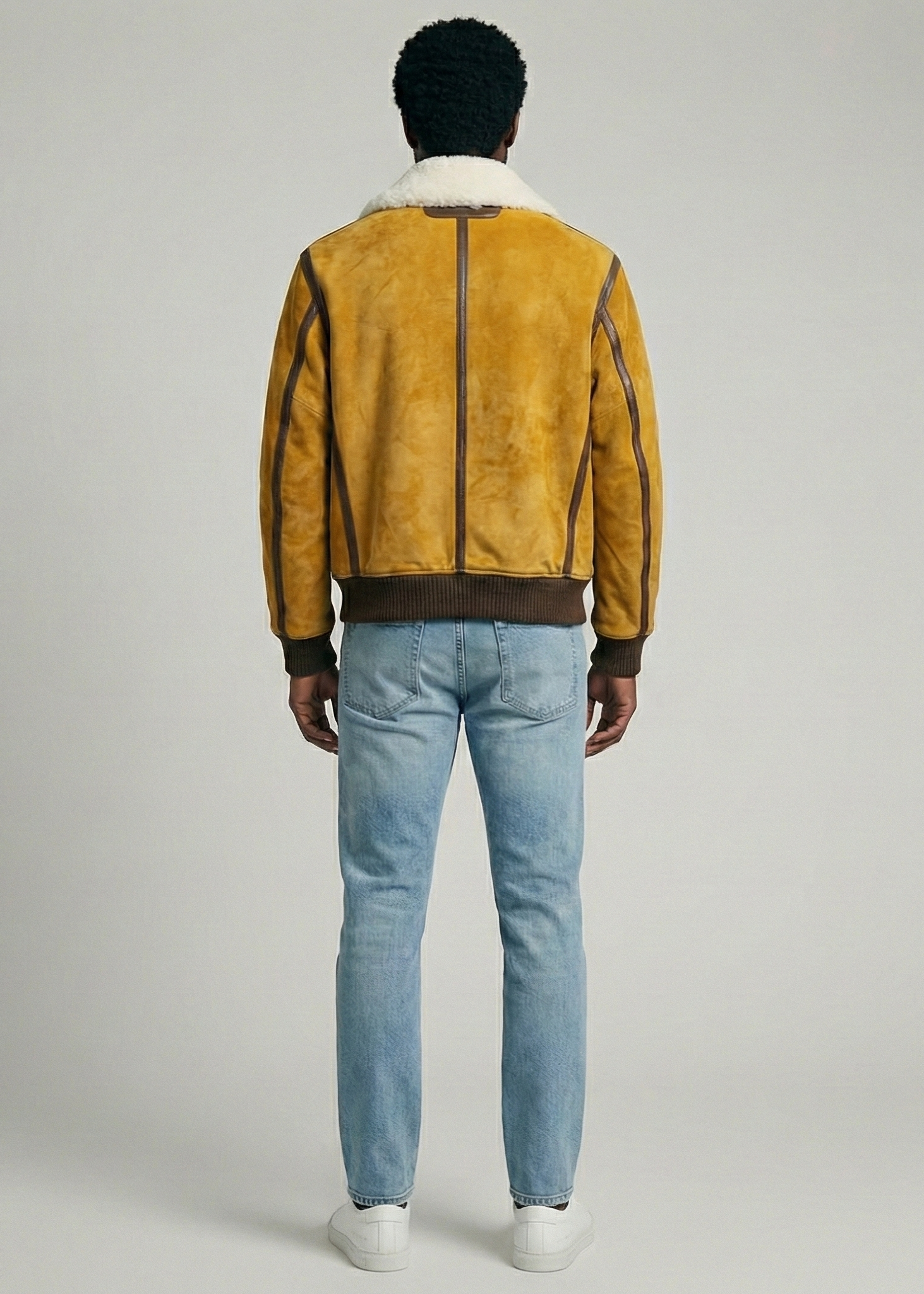 Tan suede aviator jacket with white shearling collar and ribbed cuffs by Kingsmen Couture.