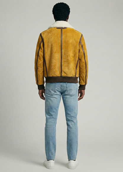 Tan suede aviator jacket with white shearling collar and ribbed cuffs by Kingsmen Couture.