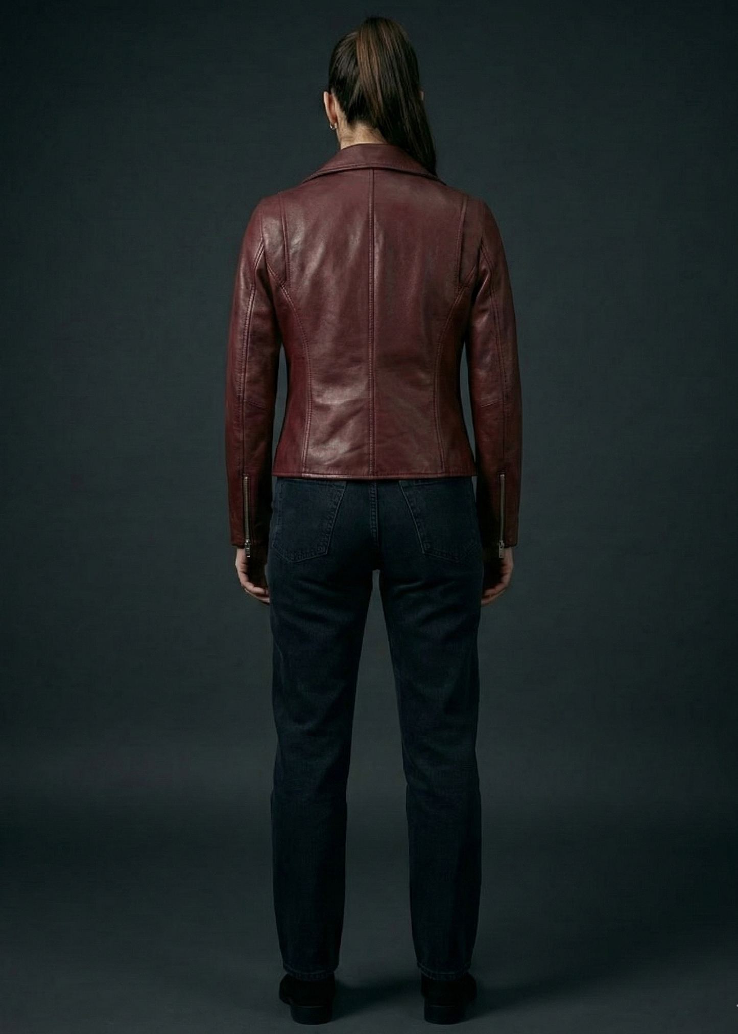 Women's burgundy sheepskin leather asymmetrical biker jacket with silver O-ring zippers by Kingsmen Couture.