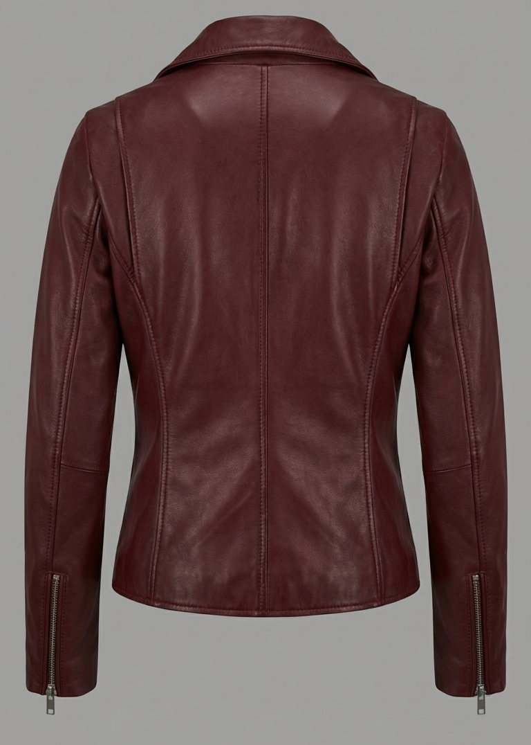 Women's burgundy sheepskin leather asymmetrical biker jacket with silver O-ring zippers by Kingsmen Couture.