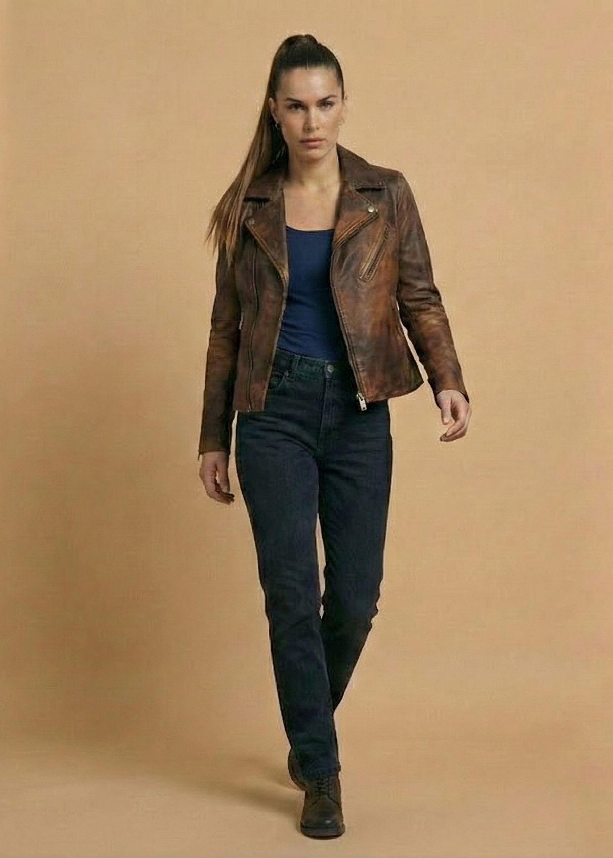 Women's distressed brown sheepskin leather biker jacket with silver hardware and animal print lining by Kingsmen Couture.